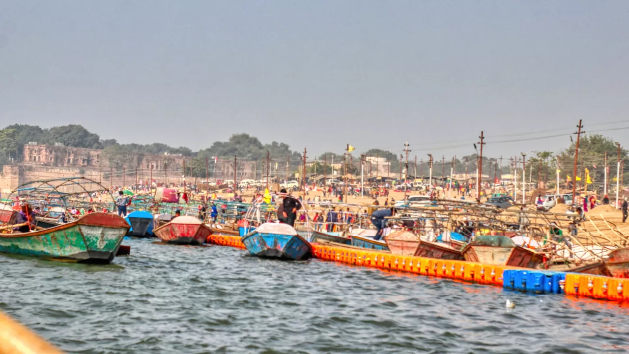 The pale Ganga meeting the darker Yamuna at the confluence in Prayagraj