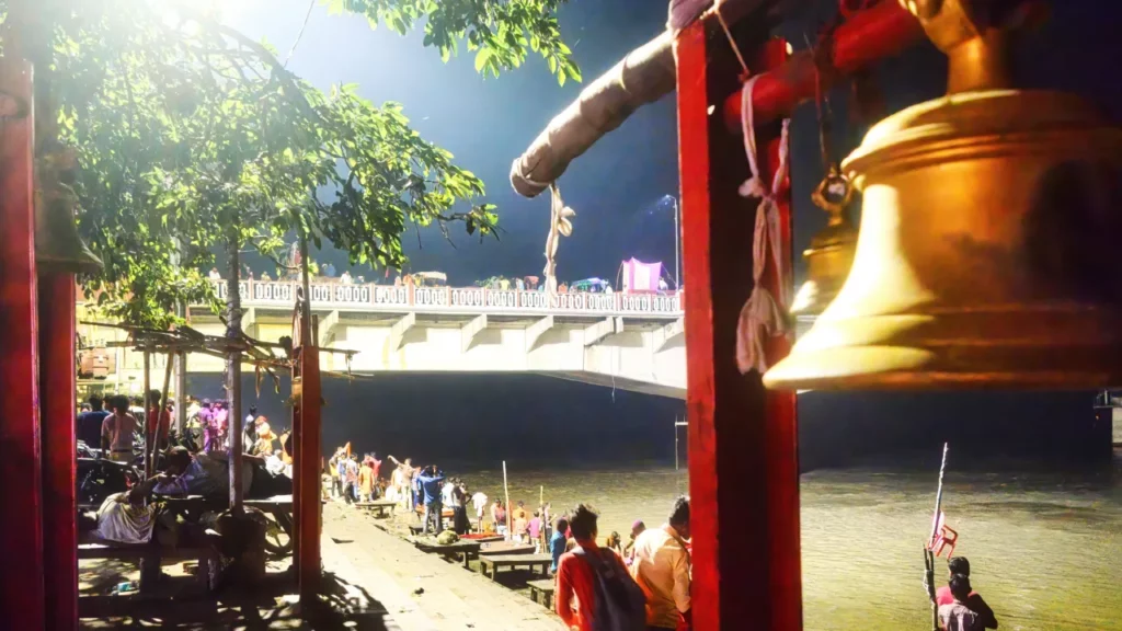 The Saryu ghat lit with lamps at night