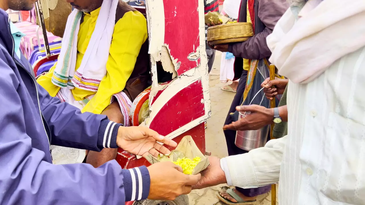 Food being served to pilgrims during Anna Daan at the Magh Mela